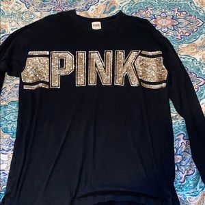 Black long sleeve with gold sequence lettering